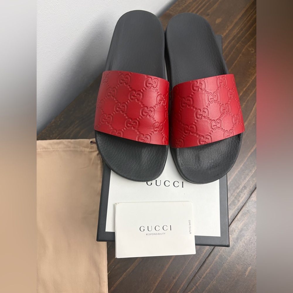 Gucci Women’s Embossed Red and Black Slides
